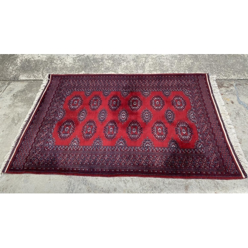 148 - Vintage Bukhara Hand Knitted Rug in Vibrant Red and Traditional Pattern (Tekke Gul Motif)