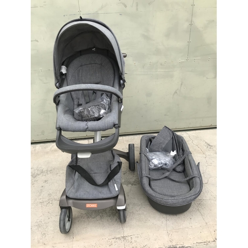 519 - Stokke Push Chair, Carry Cot Together with Cup Holder and Rain Protection