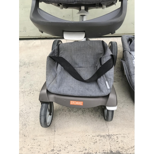 519 - Stokke Push Chair, Carry Cot Together with Cup Holder and Rain Protection