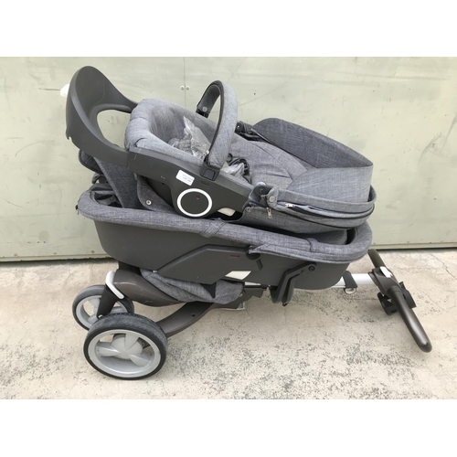 519 - Stokke Push Chair, Carry Cot Together with Cup Holder and Rain Protection