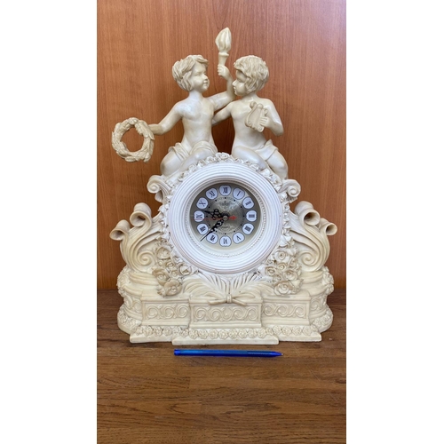 66 - French Style Cherub Mantle Clock (34cm L., 40cm H.)