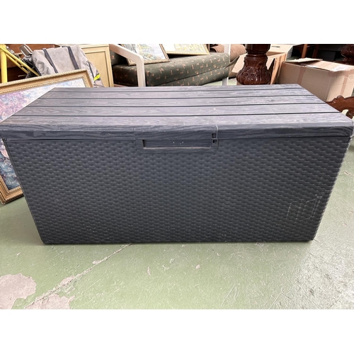 262 - Black Plastic Opening Up Storage Chest/Trunk (124 W. x 54 D. x 56cm H.)