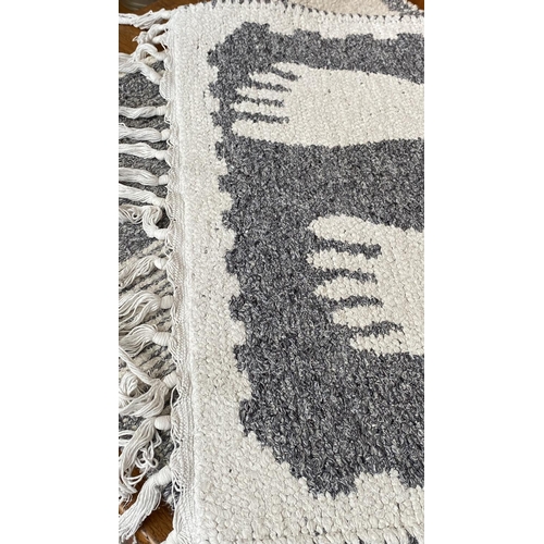 81 - x2 Small Cream and Grey Woven Rugs with Fringes (57 x 54cm and 124 x 58cm)