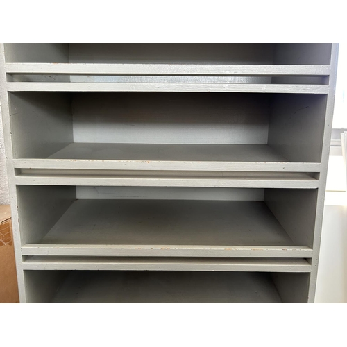 36 - Wooden 9-Shelve Cabinet with Sloping Shelves (70 W. x 35 D. x 195cm H.)