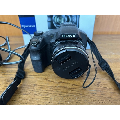 6 - Sony DSC-HX200V Cyber-Shot DSLR Camera with Charger - Code AM7110B