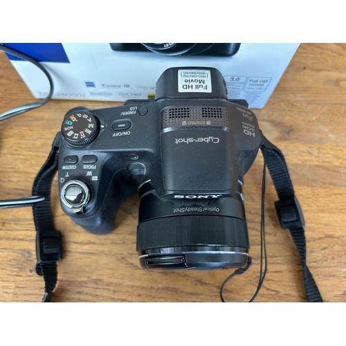 6 - Sony DSC-HX200V Cyber-Shot DSLR Camera with Charger - Code AM7110B