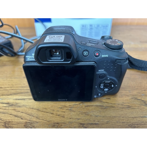 6 - Sony DSC-HX200V Cyber-Shot DSLR Camera with Charger - Code AM7110B