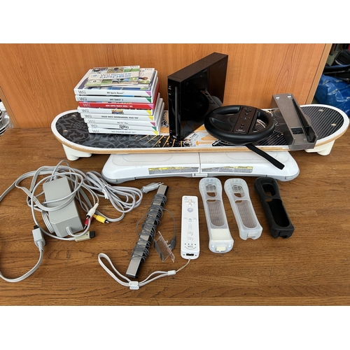 5 - Nintendo Wii Black Console Bundle with Control Protective Covers Qty of Games and Other