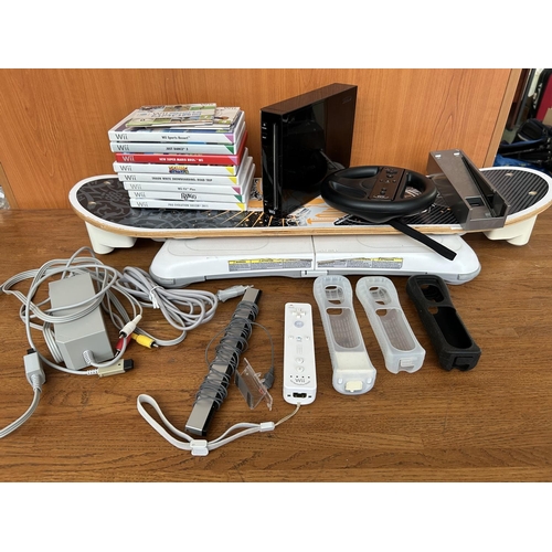 5 - Nintendo Wii Black Console Bundle with Control Protective Covers Qty of Games and Other