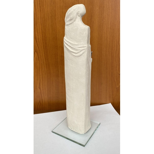 16 - Ceramic Woman's Figure Holding Bird on Glass Base Signed 'DR' in Greek (30cm H.)