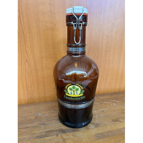 114 - Vintage Amber Glass Wine Bottle With Metal Handle and Porcelain Lid