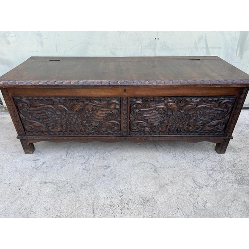 175 - Antique Solid Oak Trunk with Two Head Eagle Carvings (125 W. x 46 D. x 47cm H.)