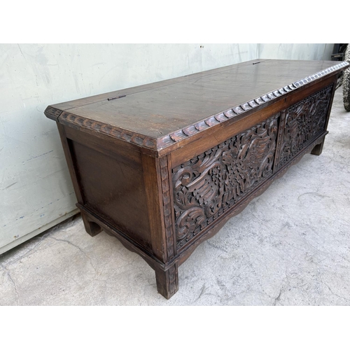 175 - Antique Solid Oak Trunk with Two Head Eagle Carvings (125 W. x 46 D. x 47cm H.)