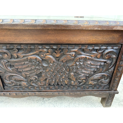 175 - Antique Solid Oak Trunk with Two Head Eagle Carvings (125 W. x 46 D. x 47cm H.)