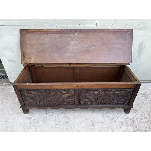 175 - Antique Solid Oak Trunk with Two Head Eagle Carvings (125 W. x 46 D. x 47cm H.)