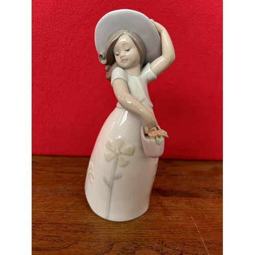 11 - Lladro Porcelain Figurine of Girl with Flower Basket (18cm H.)