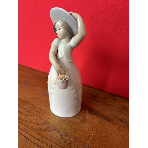 11 - Lladro Porcelain Figurine of Girl with Flower Basket (18cm H.)