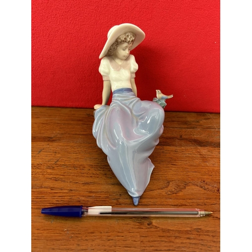 9 - NAO by Lladro Figurine of Seated Girl and Bird