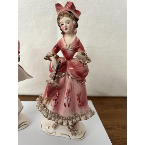 496 - Pair of Porcelain Figurines (A/F - 22cm H.)