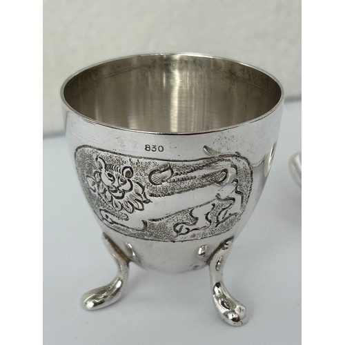 9 - Hallmarked Silver 830/800 Childrens Eggcup and Curved Spoon (49gr)