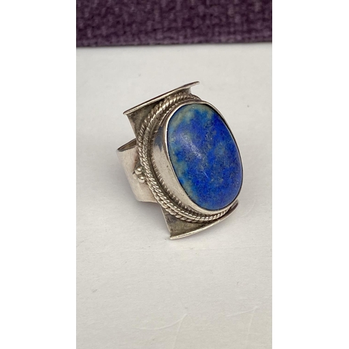 58 - Sterling Silver Lapis Lazuli Saddle Ring Surrounded by Silver Rope Decoration