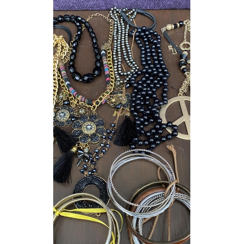 129 - Bag of Assorted Necklaces and Bracelets/Costume Jewelry