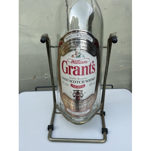 63 - Grant's Scotch Whisky 3L Empty Bottle on Swivel Stand