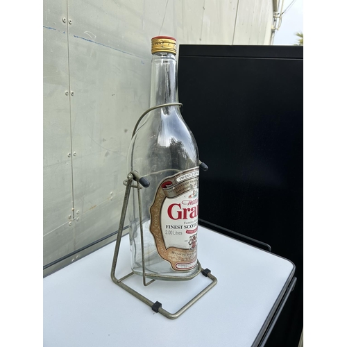 63 - Grant's Scotch Whisky 3L Empty Bottle on Swivel Stand