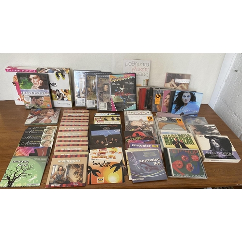 370 - Large Qty of Mostly Greek DVDs and CDs