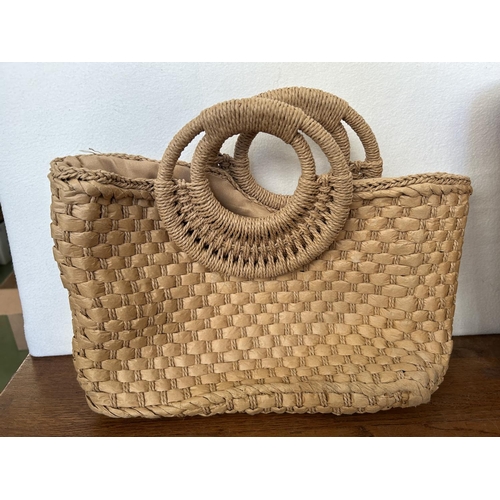 11 - Woven Basket with Rope Handles Together with a Hand Woven Straw Summer Bag with Wood Round Top Handl... 