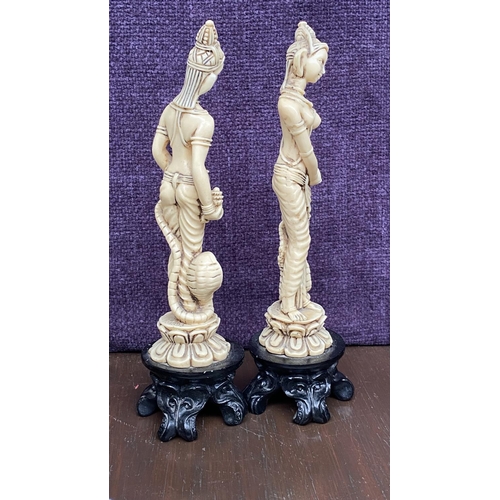 111 - x2 Asian Decorative Ivorine Resin Figurines on Black Resin 4-Footed Stand