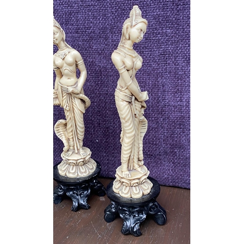 111 - x2 Asian Decorative Ivorine Resin Figurines on Black Resin 4-Footed Stand