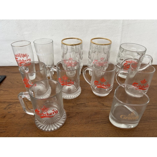 492 - Assorted Glassware Incl. x9 Carlsberg Glasses and Cake Stand