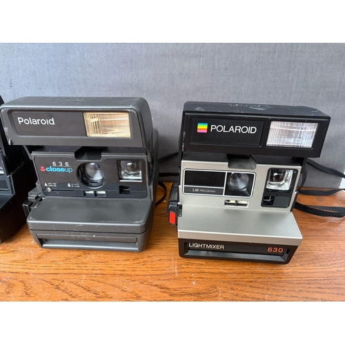 x3 Vintage Polaroid Instant Cameras