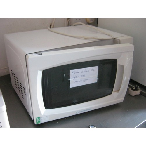 207 - A Small White Microwave Oven