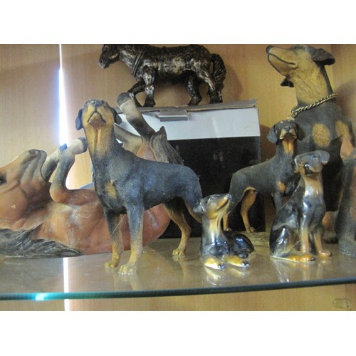 28 - Collection of bone china and other Rottweiler figures, plus other items a wooden horse bottle stand ... 