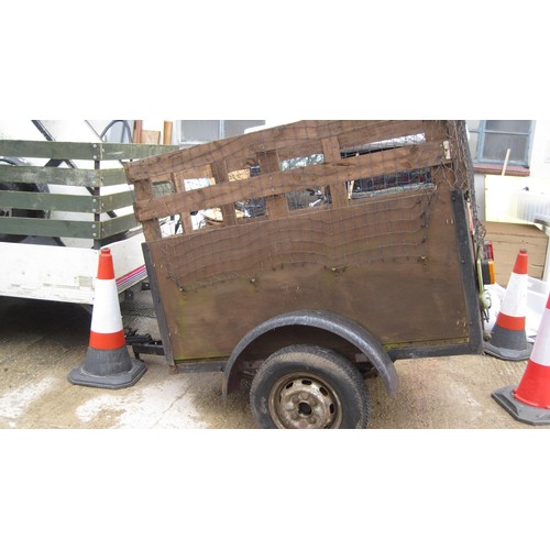 14 - High-topped wooden trailer with net cover