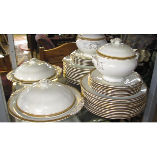 43 - A gold-trimmed white china dinner service including tureens