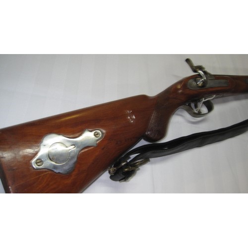 138 - A 20 bore antique percussion lock shotgun with rod and sling.