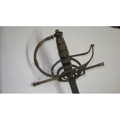 139 - An antique gentleman's sword with slim blade and basket hilt