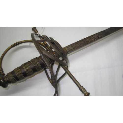 139 - An antique gentleman's sword with slim blade and basket hilt