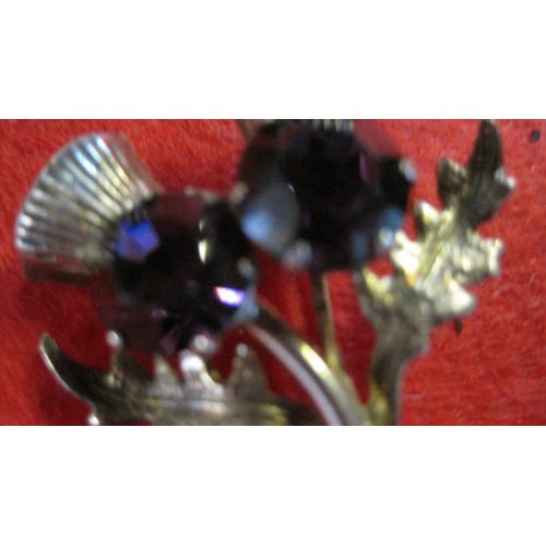 131 - A Thistle Brooch in Sterling Silver with 2 Mounted Gemstones, possibly Amethysts