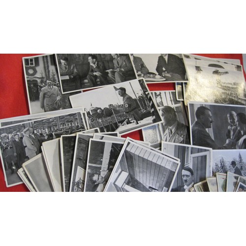 155 - A group of 35 Nazi collector's cards dating to the 1930s featuring Adolph Hitler, plus a selection o... 