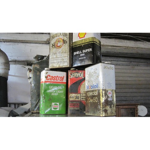 5 - An assortment of vintage oil cans and a jerry can