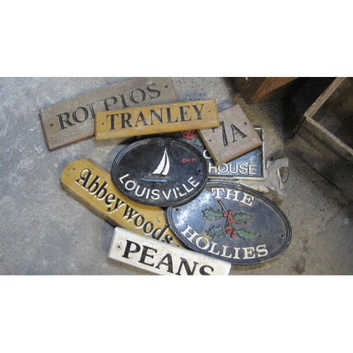 231 - A Box of mainly wooden house signs