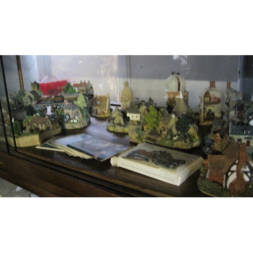 58 - A large assortment of David Winter cottages and rural building and a set of David Winter collectors ... 