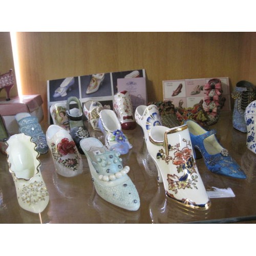 43 - A collection of ceramic shoes