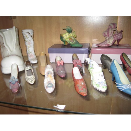 43 - A collection of ceramic shoes