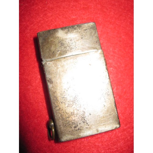 281 - A sterling silver petrol cigarette lighter marked 'Sterling Silver' and 'I.T.C.', the action spring ... 