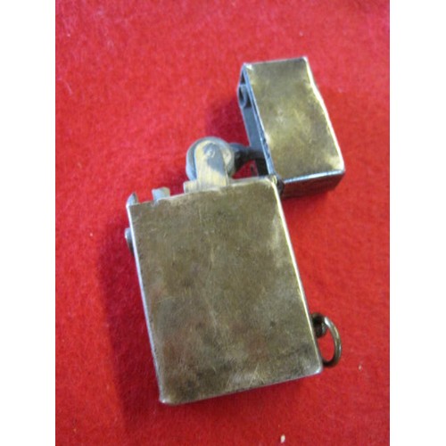 281 - A sterling silver petrol cigarette lighter marked 'Sterling Silver' and 'I.T.C.', the action spring ... 